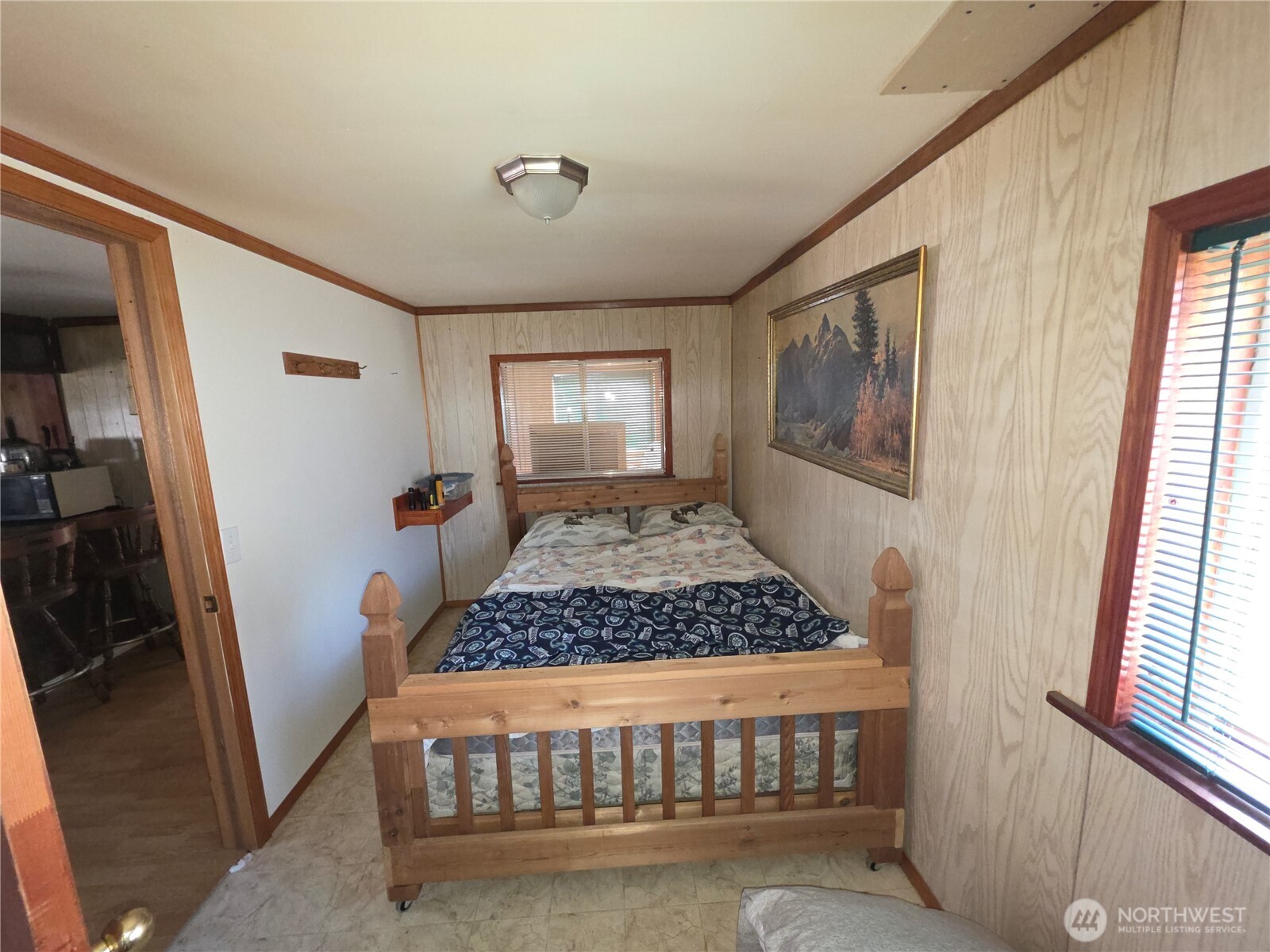 105 Emily Road Oroville, WA 98844 - Photo 8 of 24 a bedroom with wooden floor and a window