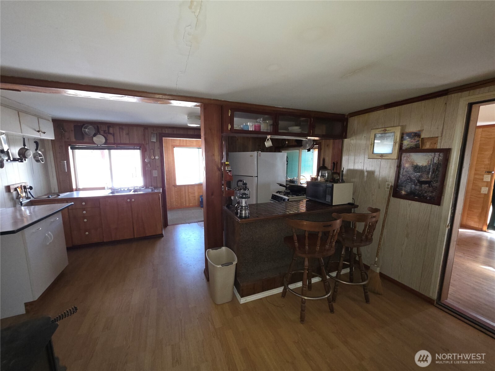 105 Emily Road Oroville, WA 98844 - Photo 9 of 24 a view of a dining room with furniture a rug and wooden floor