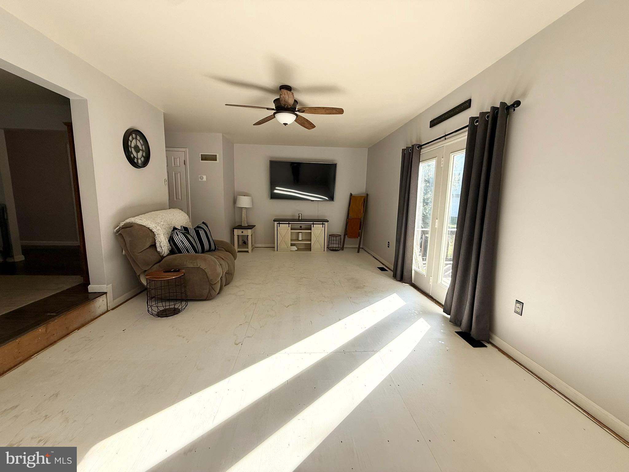 60-6 Mint Tier Reading, PA 19606 - Photo 16 of 50 a living room with furniture a flat screen tv and a fireplace