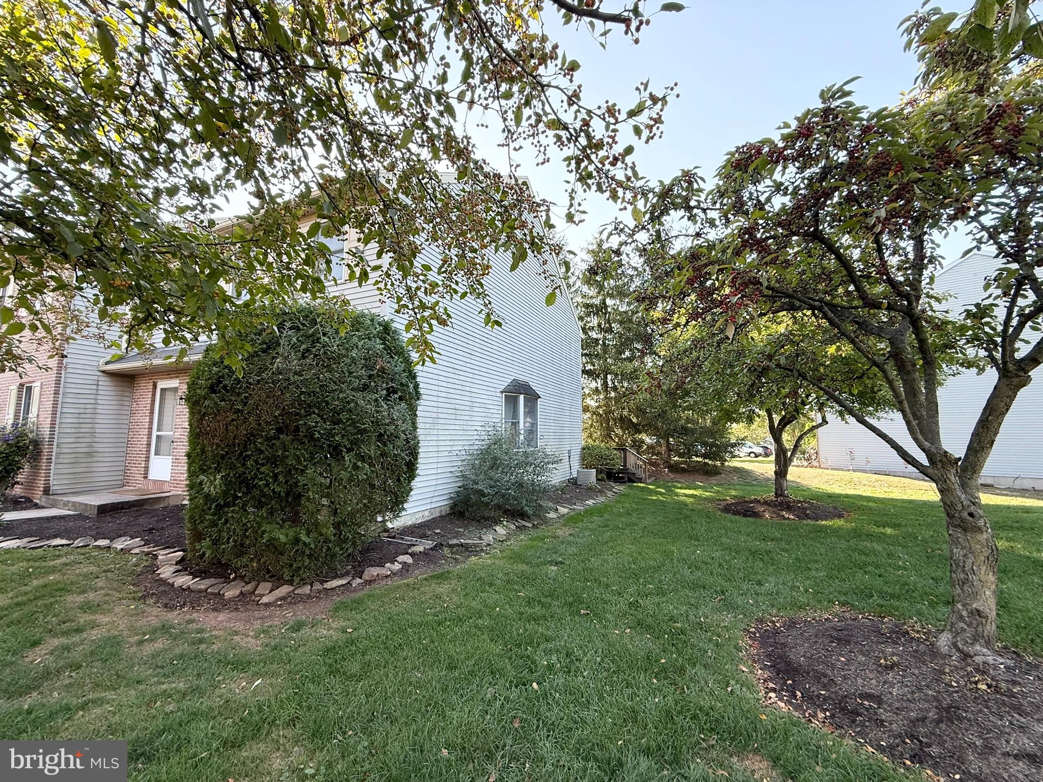 60-6 Mint Tier Reading, PA 19606 - Photo 3 of 50 a front view of a house with garden