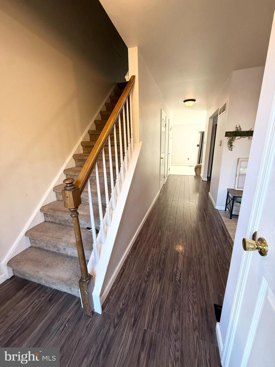 60-6 Mint Tier Reading, PA 19606 - Photo 4 of 50 a view of a hallway with wooden floor and staircase