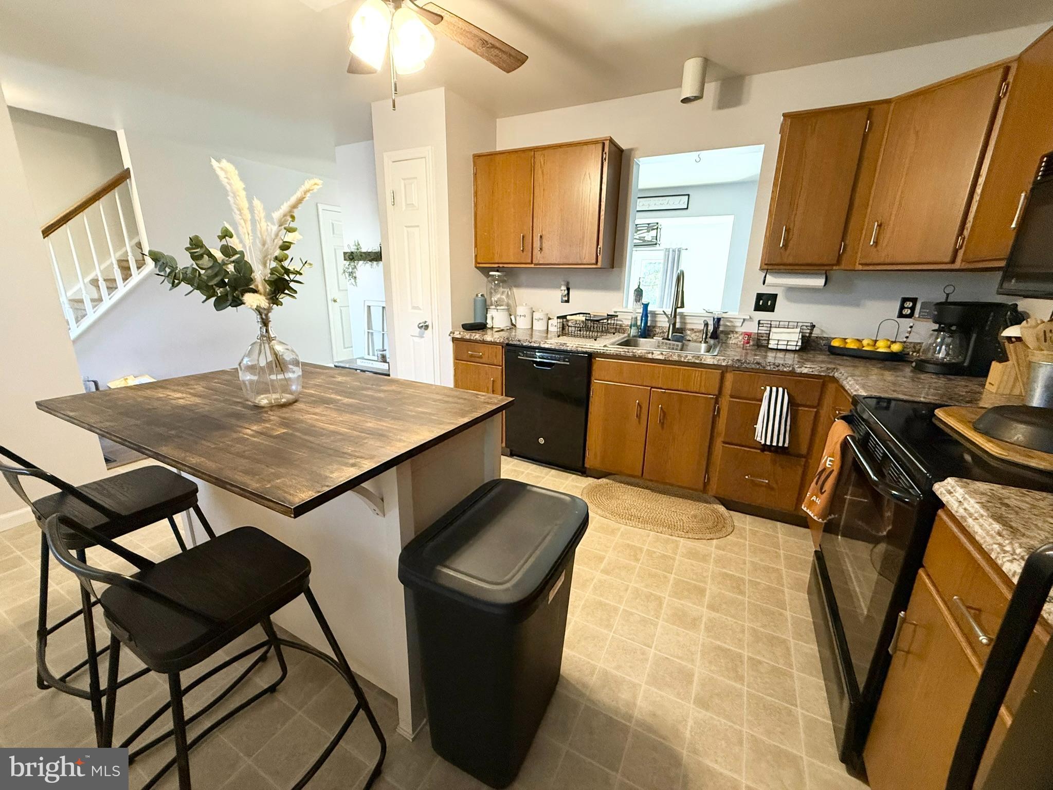 60-6 Mint Tier Reading, PA 19606 - Photo 9 of 50 a kitchen with a table chairs stove and cabinets