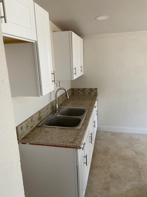 a kitchen with stainless steel appliances granite countertop a sink and dishwasher