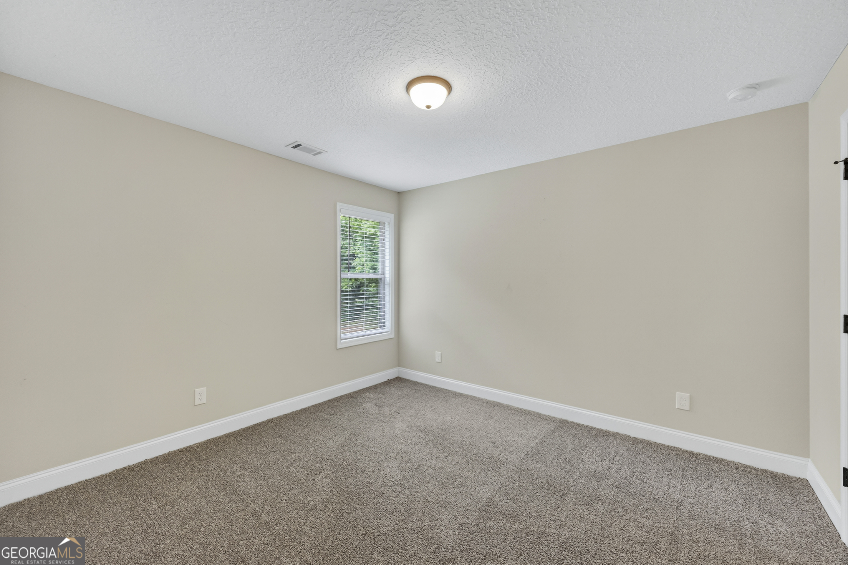 717 Oconee Lane Commerce, GA 30529 - Photo 33 of 57 a view of an empty room with a window