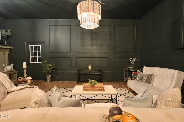 a view of house with backyard and seating space