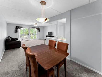 a view of a dining room with furniture window and outside view