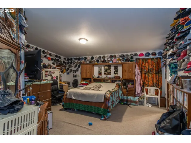 a bedroom with furniture and a book shelf