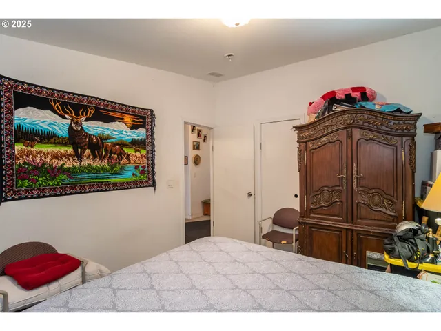 a bedroom with a bed and cabinets