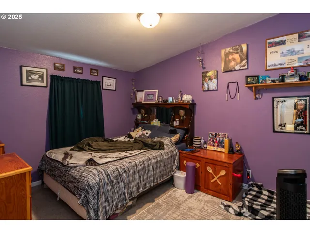 a bedroom with furniture and a bed