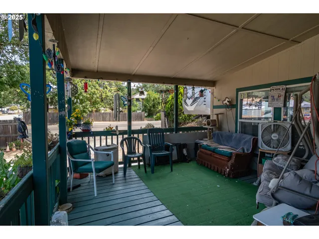 a sitting area with furniture and a garden