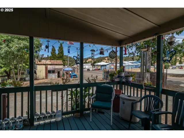 a view of a chairs and table in patio