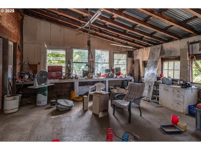 a living room with lots of furniture and a chandelier