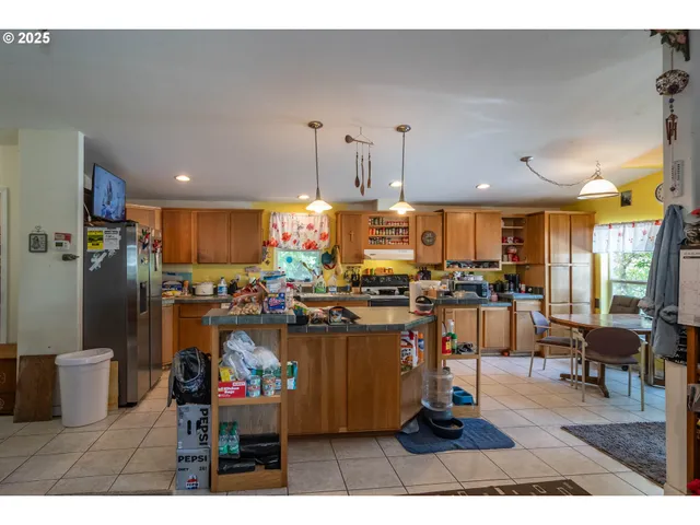 a kitchen with a table and chairs