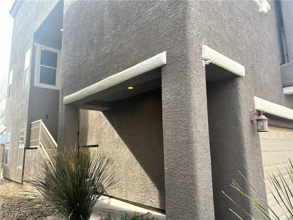9535 Leaping Lizard Street Las Vegas, NV 89178 - Photo 30 of 37 View of home's exterior, stairs lead to the front door.