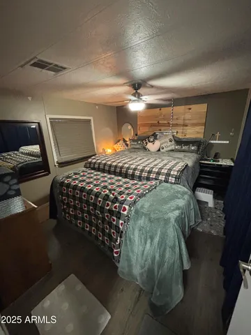 a bedroom with a bed and window