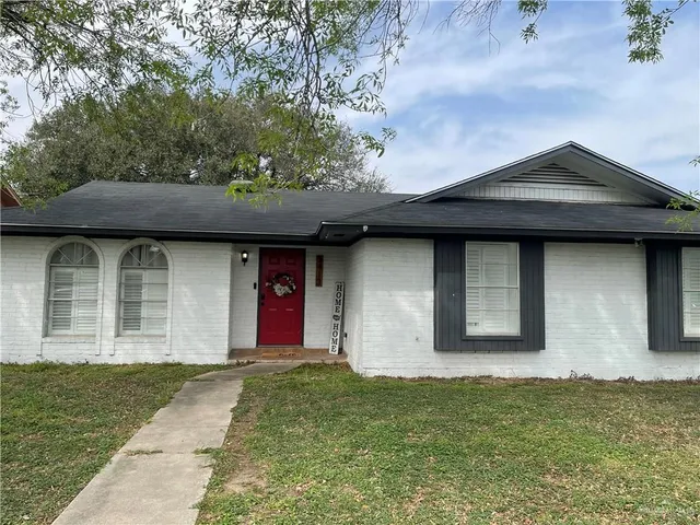 a front view of a house with garage
