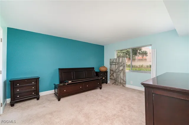 a utility room with cabinets washer and dryer