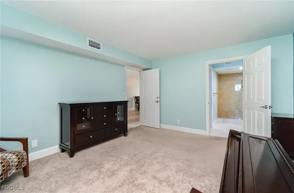 a room with a dresser and a mirror