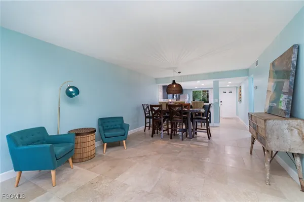 a view of a livingroom with furniture and a chair