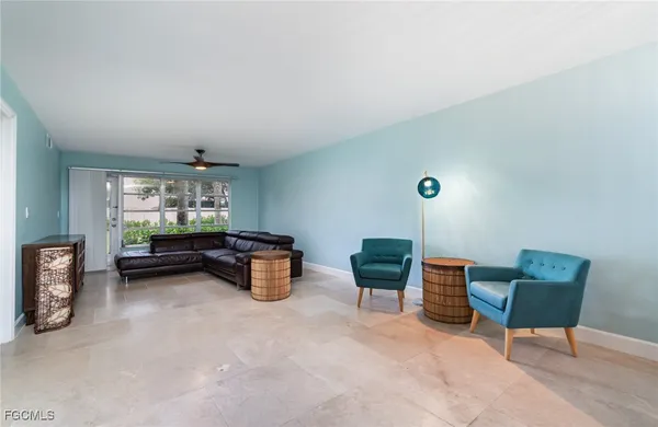 a view of work space with furniture and window