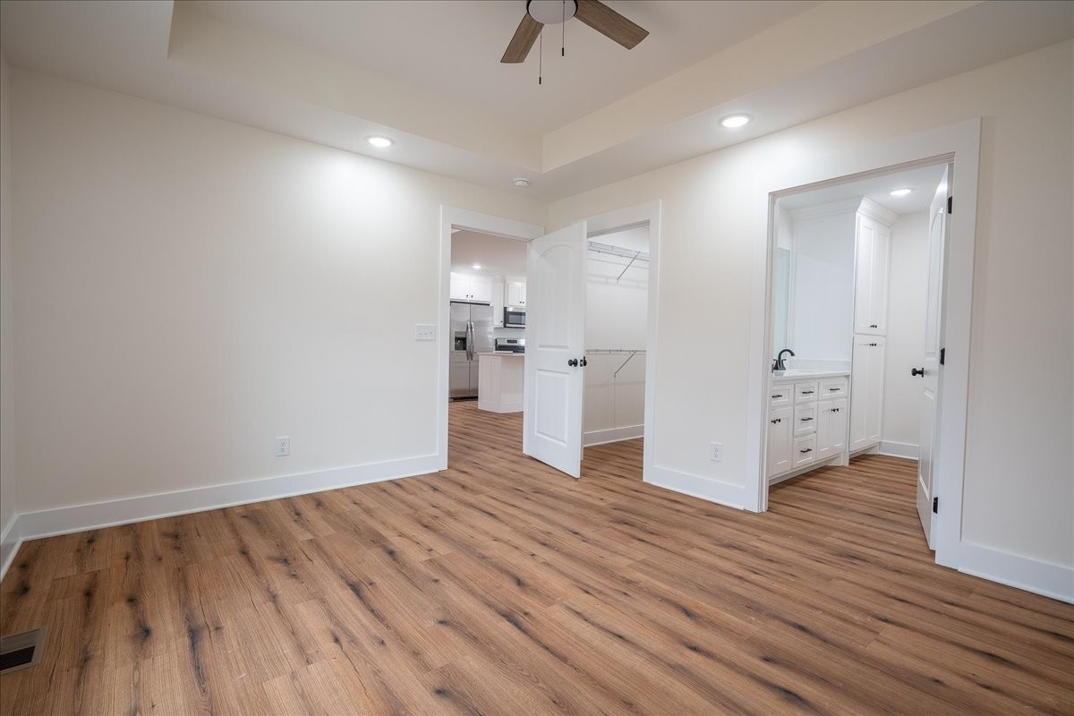 3987 Buffalo Road Summertown, TN 38483 - Photo 18 of 26 wooden floor in an empty room with a window