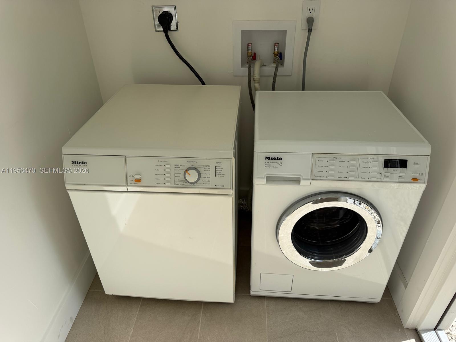 18481 Southwest 208th Street, Unit 18481 Miami, FL 33187 - Photo 8 of 12 a utility room with dryer and washer