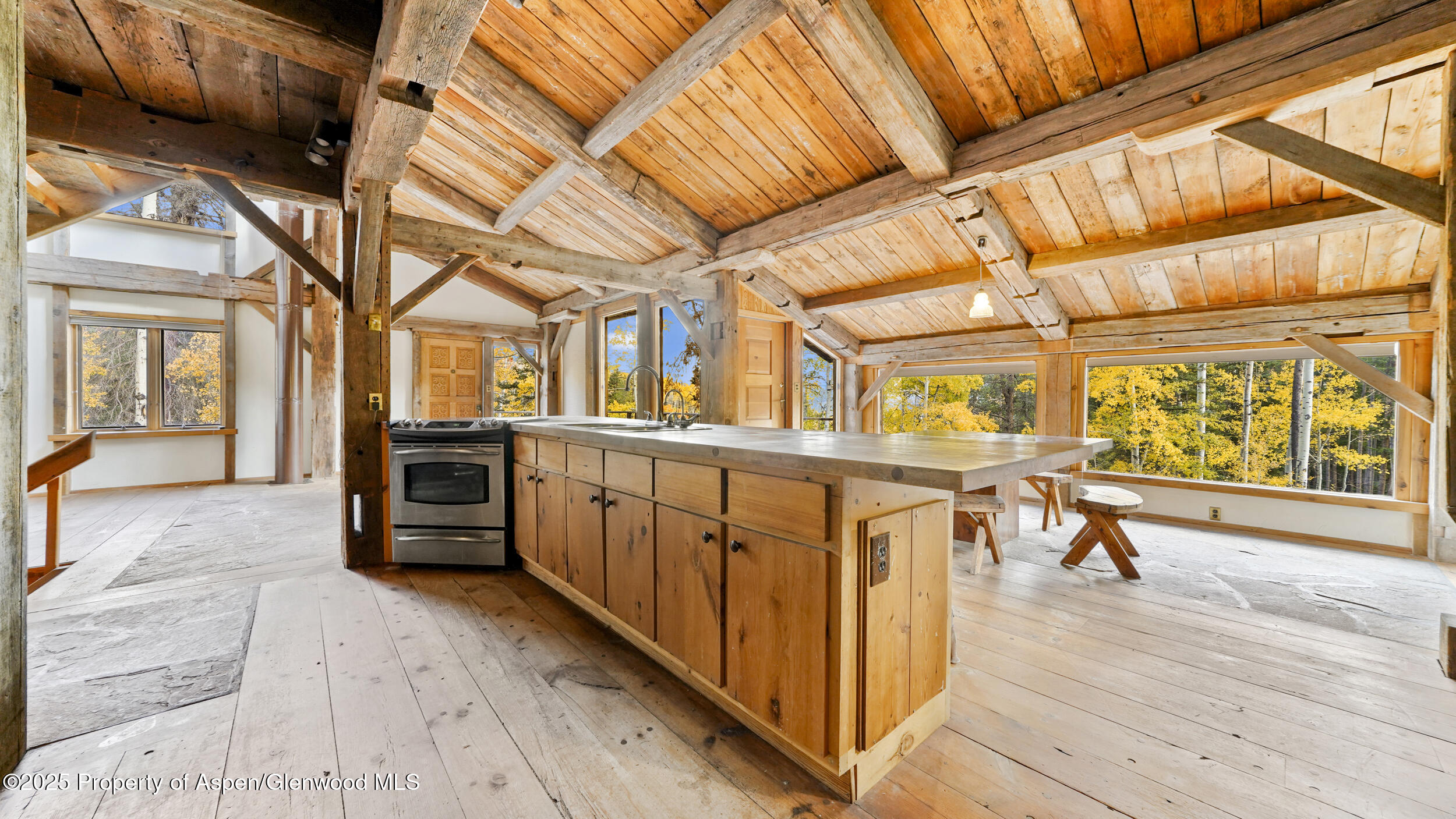 1315 Ruedi Creek Road Basalt, CO 81621 - Photo 11 of 48 a view of a porch with wooden floor and furniture