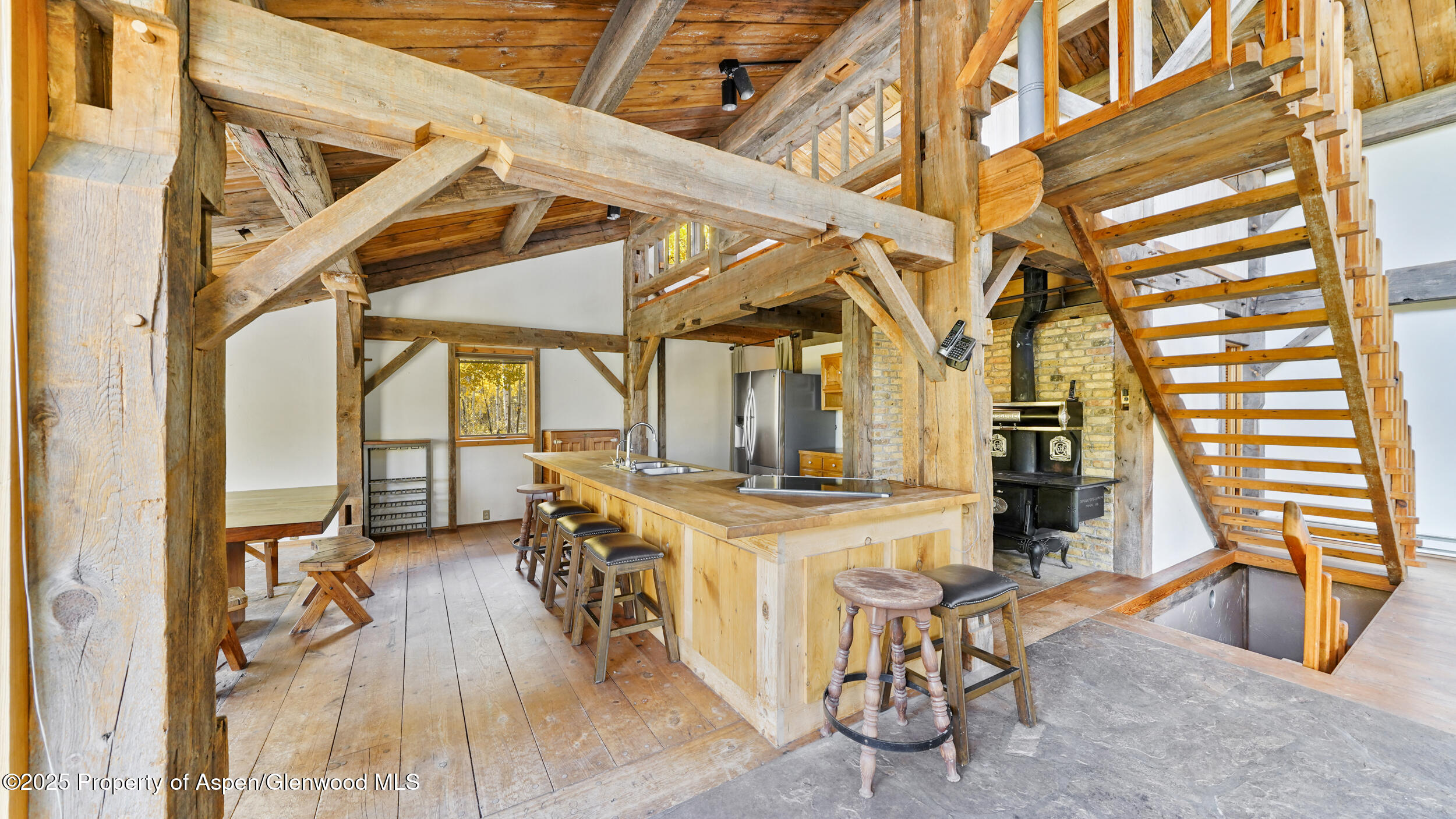 1315 Ruedi Creek Road Basalt, CO 81621 - Photo 12 of 48 a view of a kitchen with furniture and wooden floor