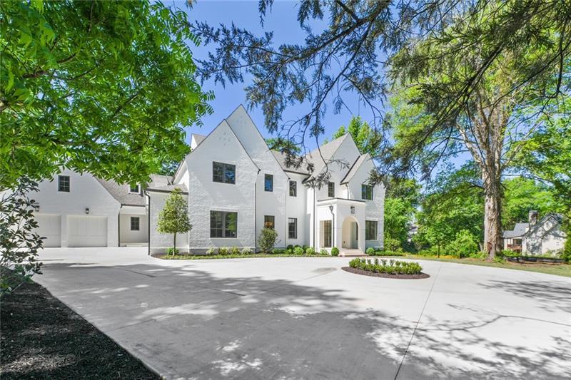 3044 Howell Mill Road Northwest Atlanta, GA 30327 - Photo 1 of 1 a front view of a house with a garden