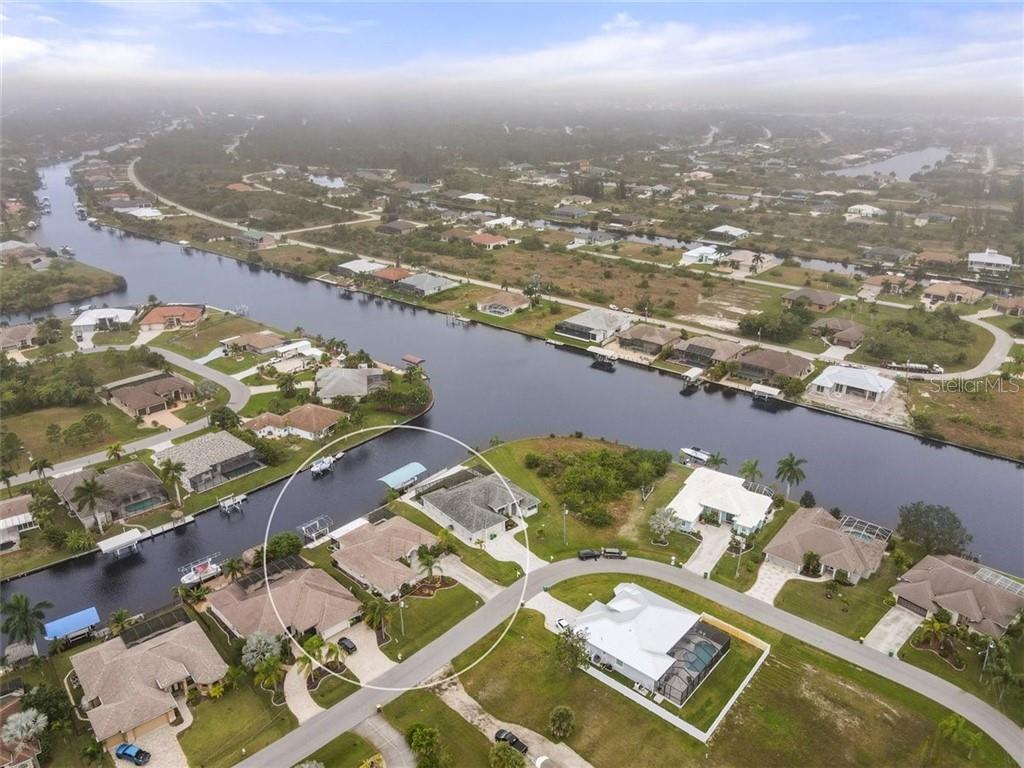 9284 Spring Circle Port Charlotte, FL 33981 - Photo 1 of 1 Waterfront location at the intersection of two canals!
