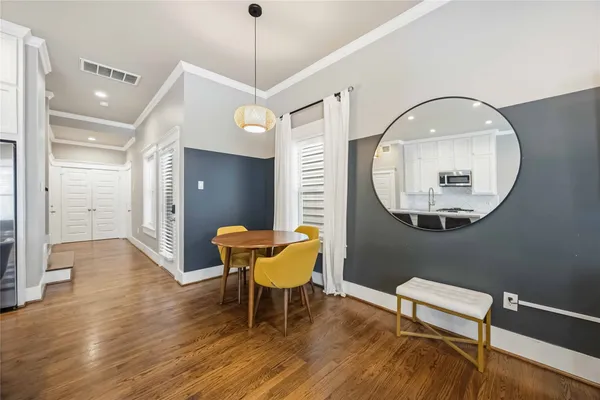 a view of a livingroom with furniture and a mirror