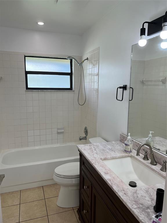 371 Mohawk Lane Boca Raton, FL 33487 - Photo 11 of 26 a bathroom with a granite countertop sink a toilet and shower