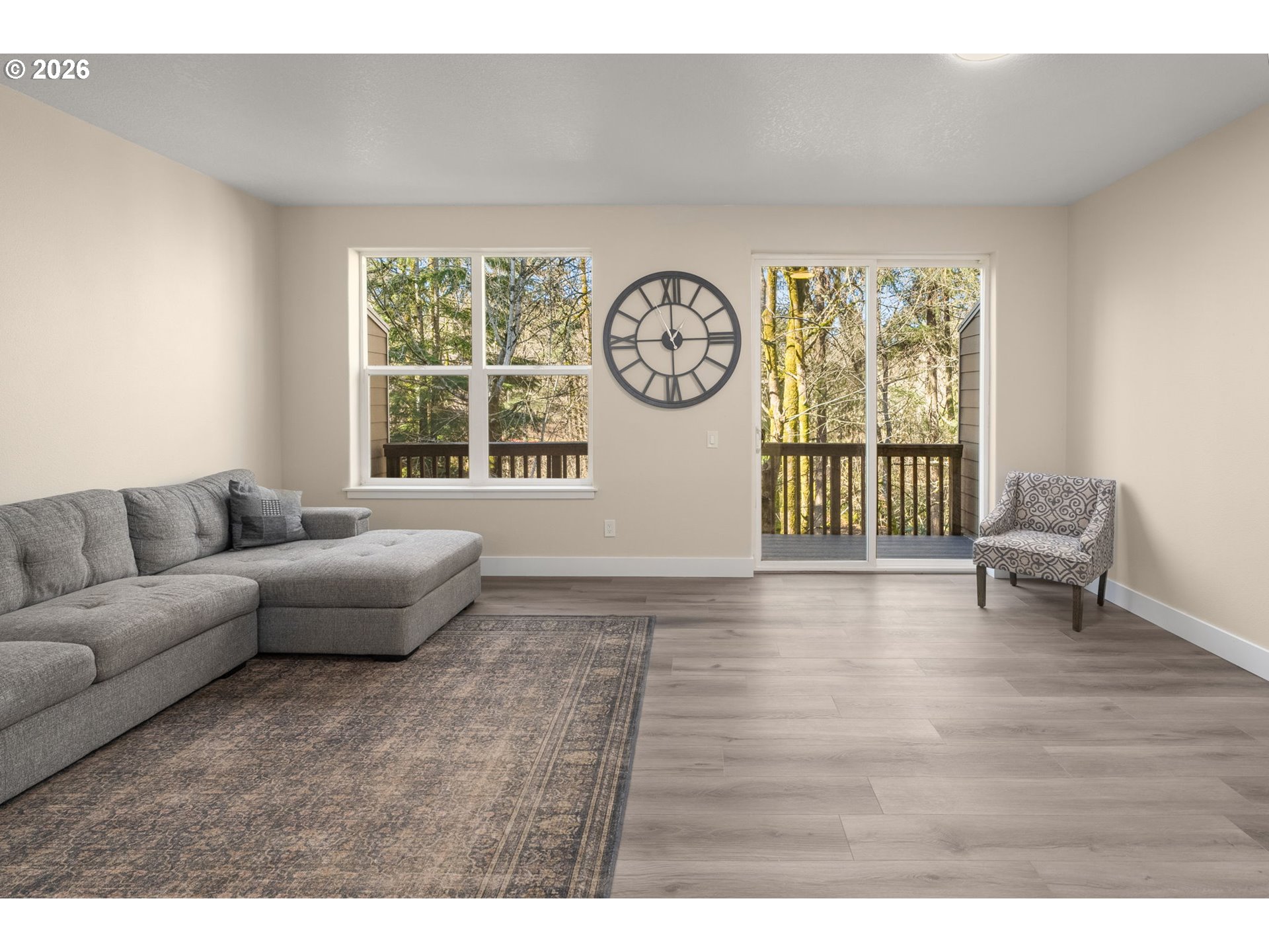 13193 Southwest Raptor Place Tigard, OR 97223 - Photo 12 of 27 a living room with furniture and a large window