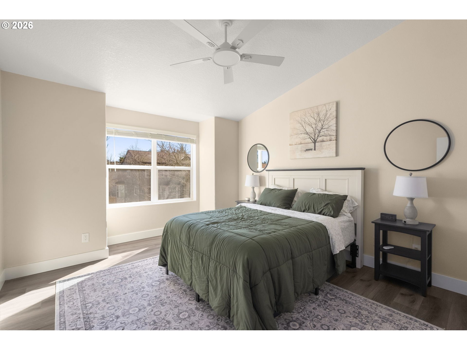 13193 Southwest Raptor Place Tigard, OR 97223 - Photo 15 of 27 a bedroom with a bed a table and chair