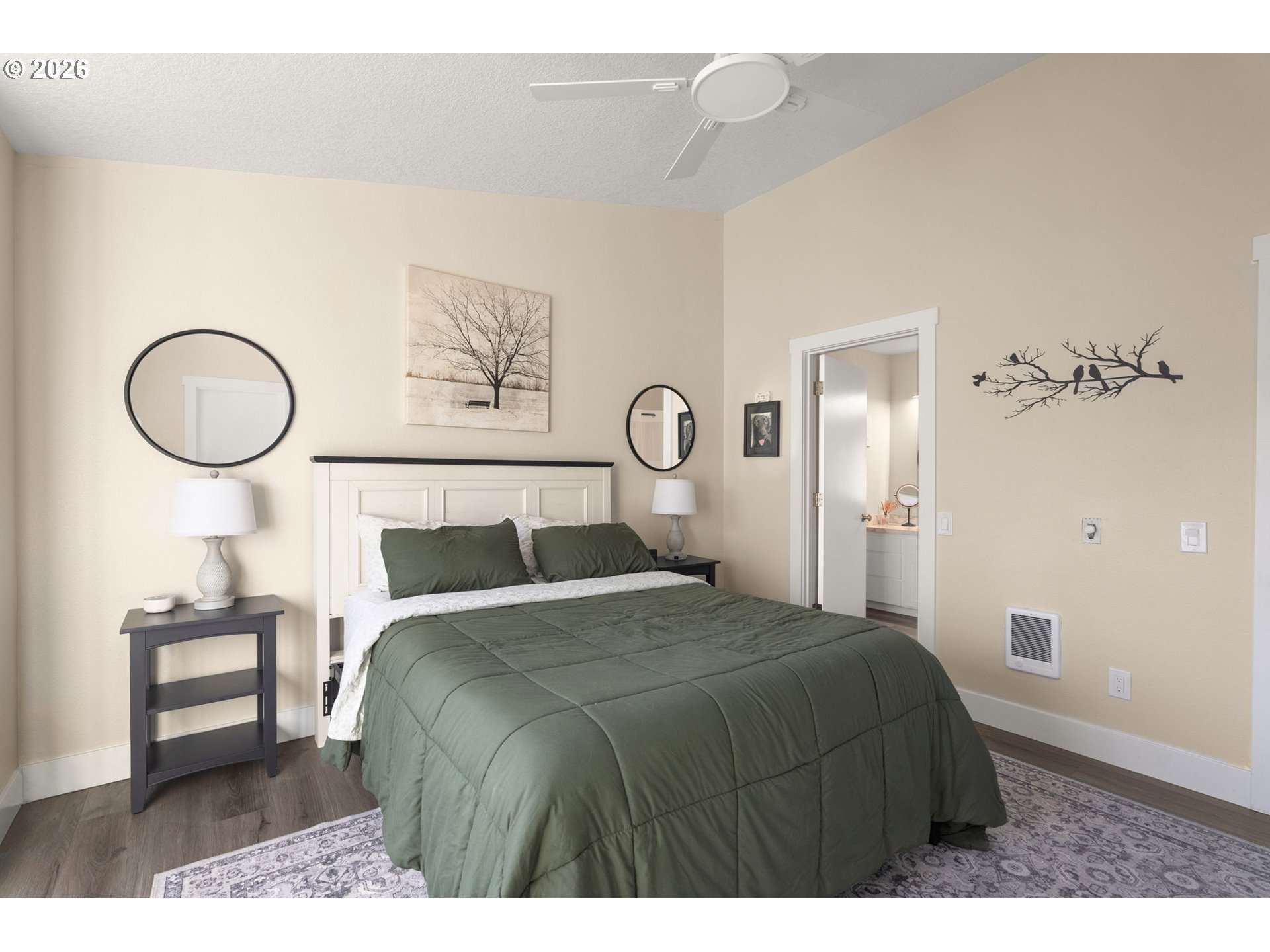 13193 Southwest Raptor Place Tigard, OR 97223 - Photo 16 of 27 a bedroom with a bed and a chandelier