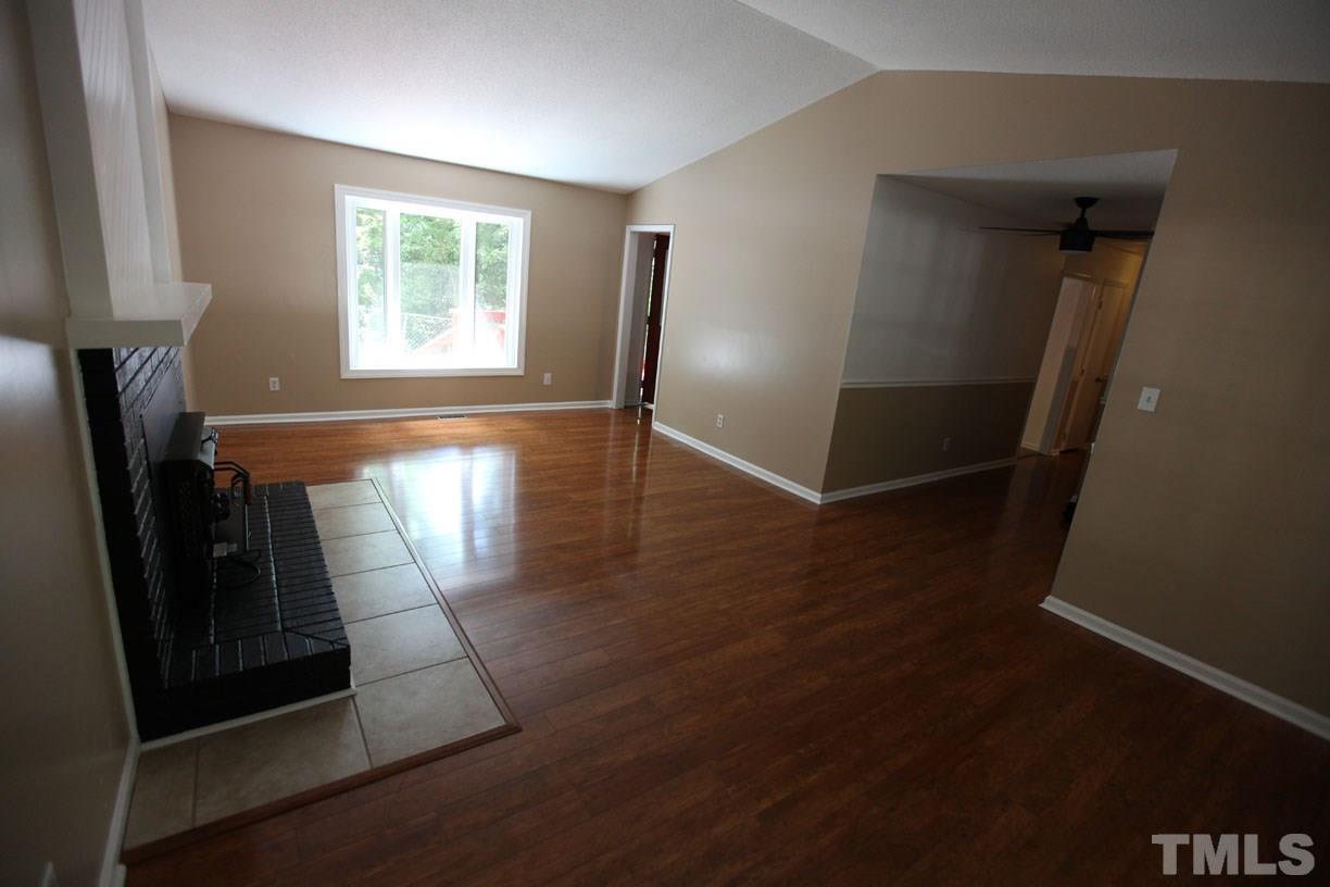 7319 Post Oak Road Raleigh, NC 27615 - Photo 3 of 12 wooden floor in an empty room with a window