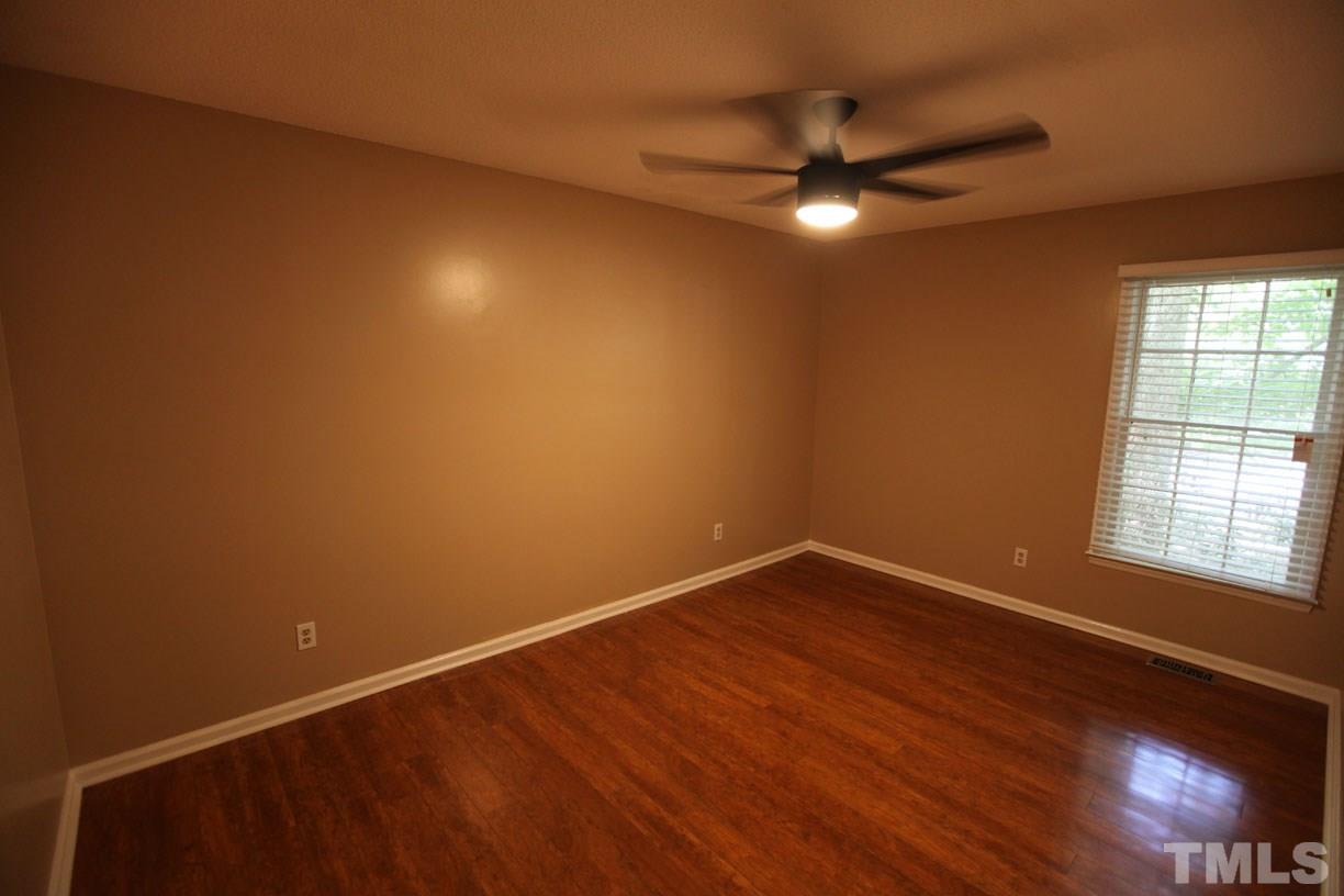 7319 Post Oak Road Raleigh, NC 27615 - Photo 8 of 12 a view of an empty room with a window