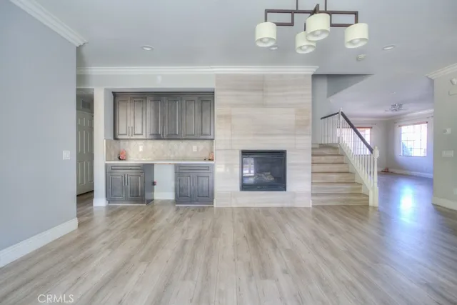 a large kitchen with stainless steel appliances sink a microwave and cabinets