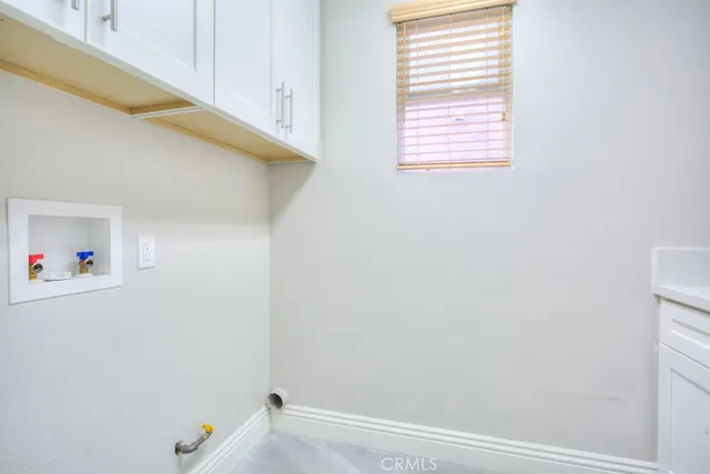 a view of staircase with white walls and windows