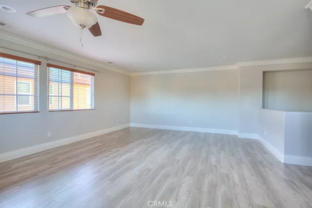 a view of livingroom with furniture wooden floor and window