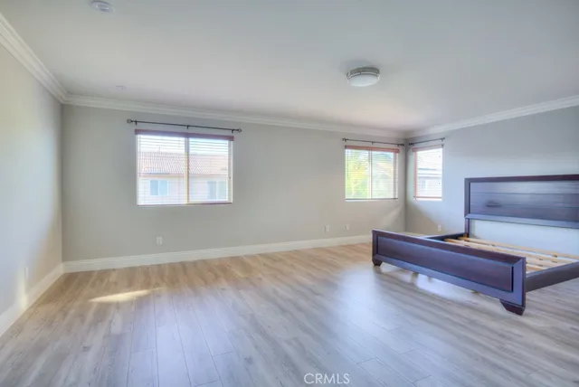 a room with pool table and windows