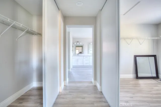 a spacious bathroom with a double vanity sink and a mirror