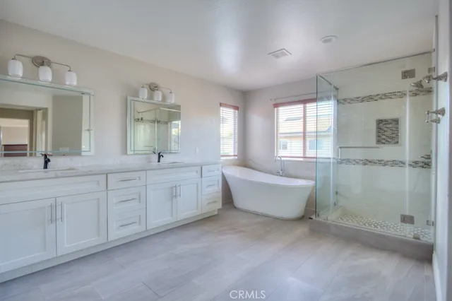 a spacious bathroom with a bathtub sink and toilet