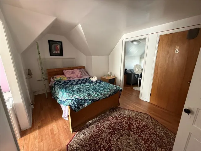 a living room with large couch and a rug