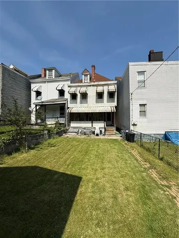 a view of house with outdoor space and swimming pool