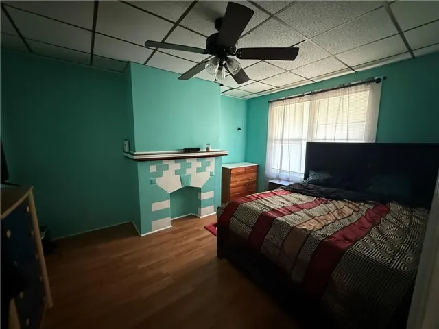 a bedroom with a bed and a window