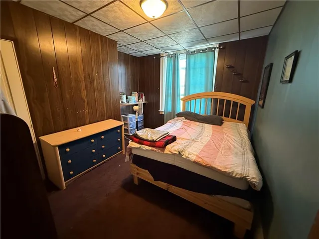 a bed room with a bed and a window