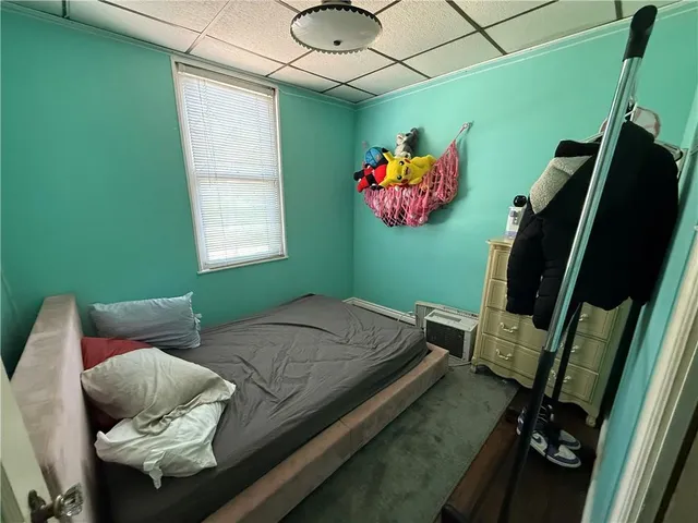a bedroom with a bed and furniture