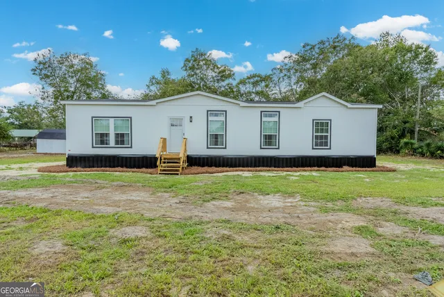 a house view with a garden space