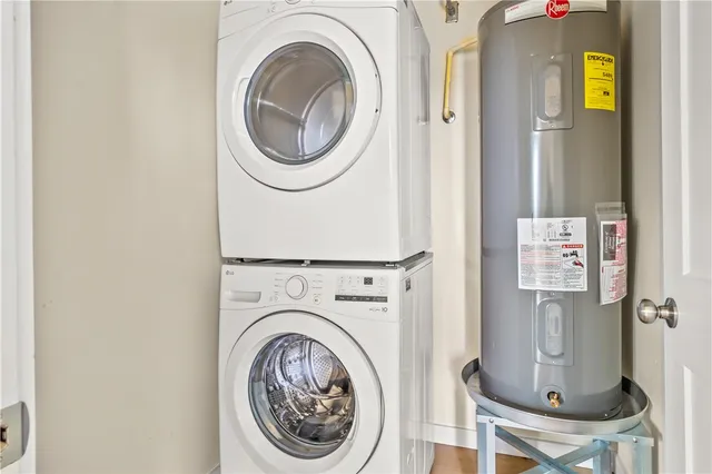 a close view of a utility room with dryer and washer